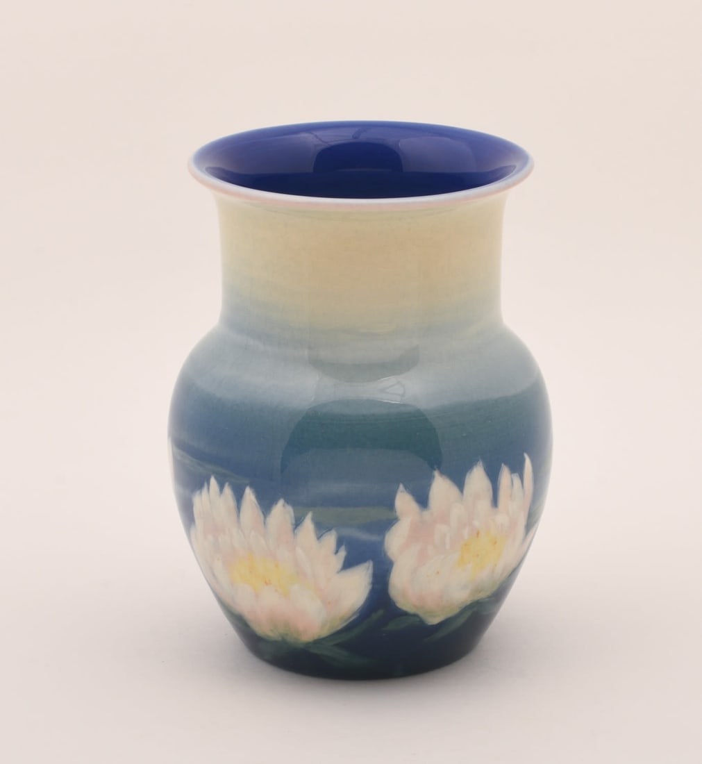Rookwood Jewel Porcelain Vase: decorated with water lillies. E.T Hurley, 1944. 6 1/4 inches high, 5 inches diameter. Impressed Rookwood Pottery Flame mark, XLIV/6315, artist's cipher.
