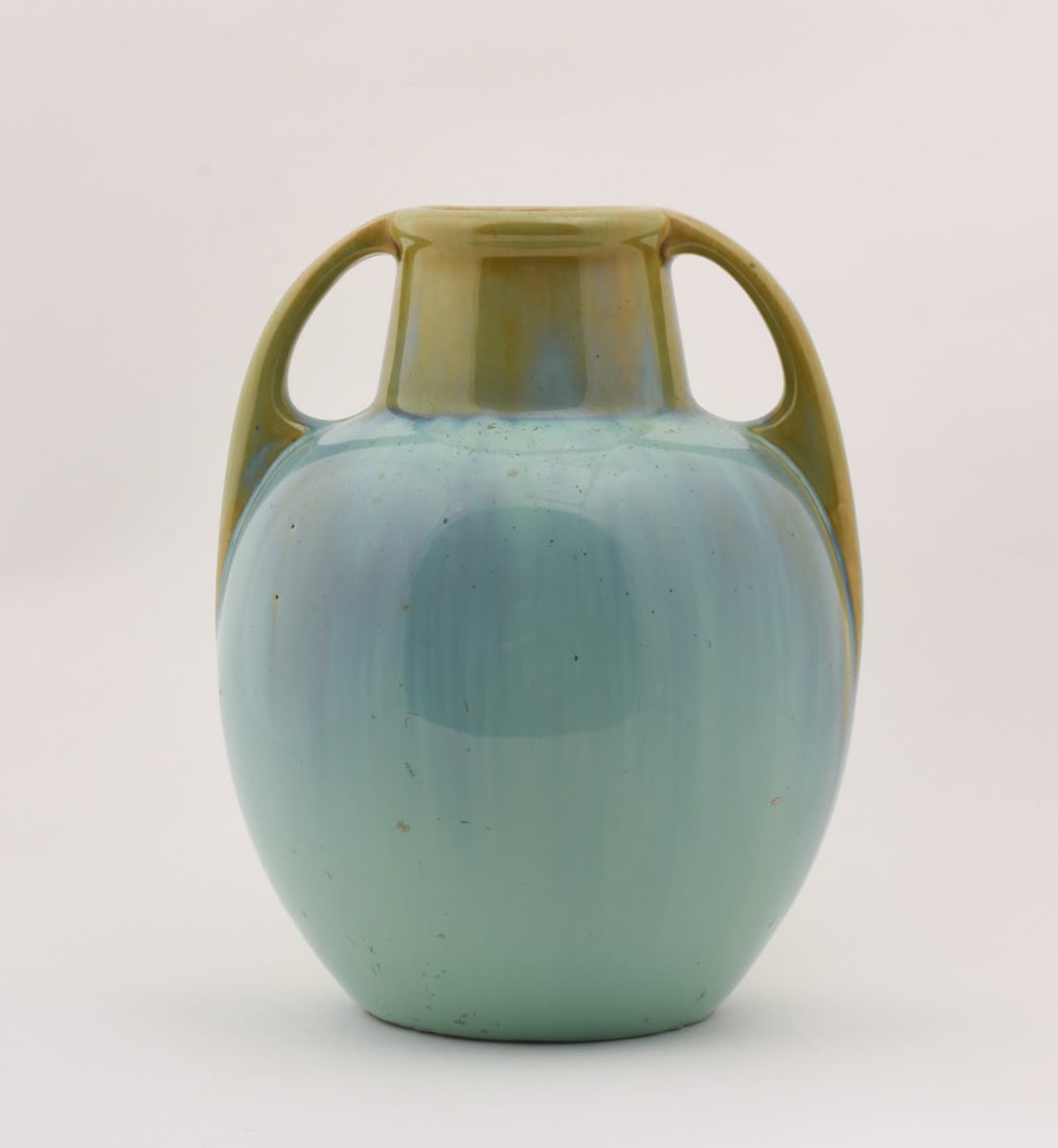 Fulper Pottery Vase: with light blue-green flowing glaze. 6 1/4 inches high, 6 inches wide, 5 3/4 inches deep. Vertical Fulper black ink mark. incised D643.