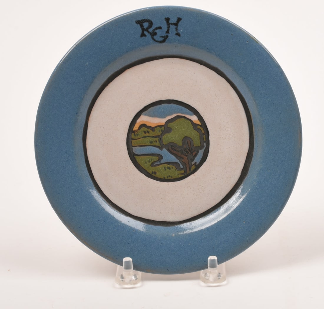 Saturday Evening Girls Charger: with House Medallion. 1 1/2 inches high, 12 5/8 inches diameter. Sara Galner, S.E.G. / 9-21 / artist's cipher.