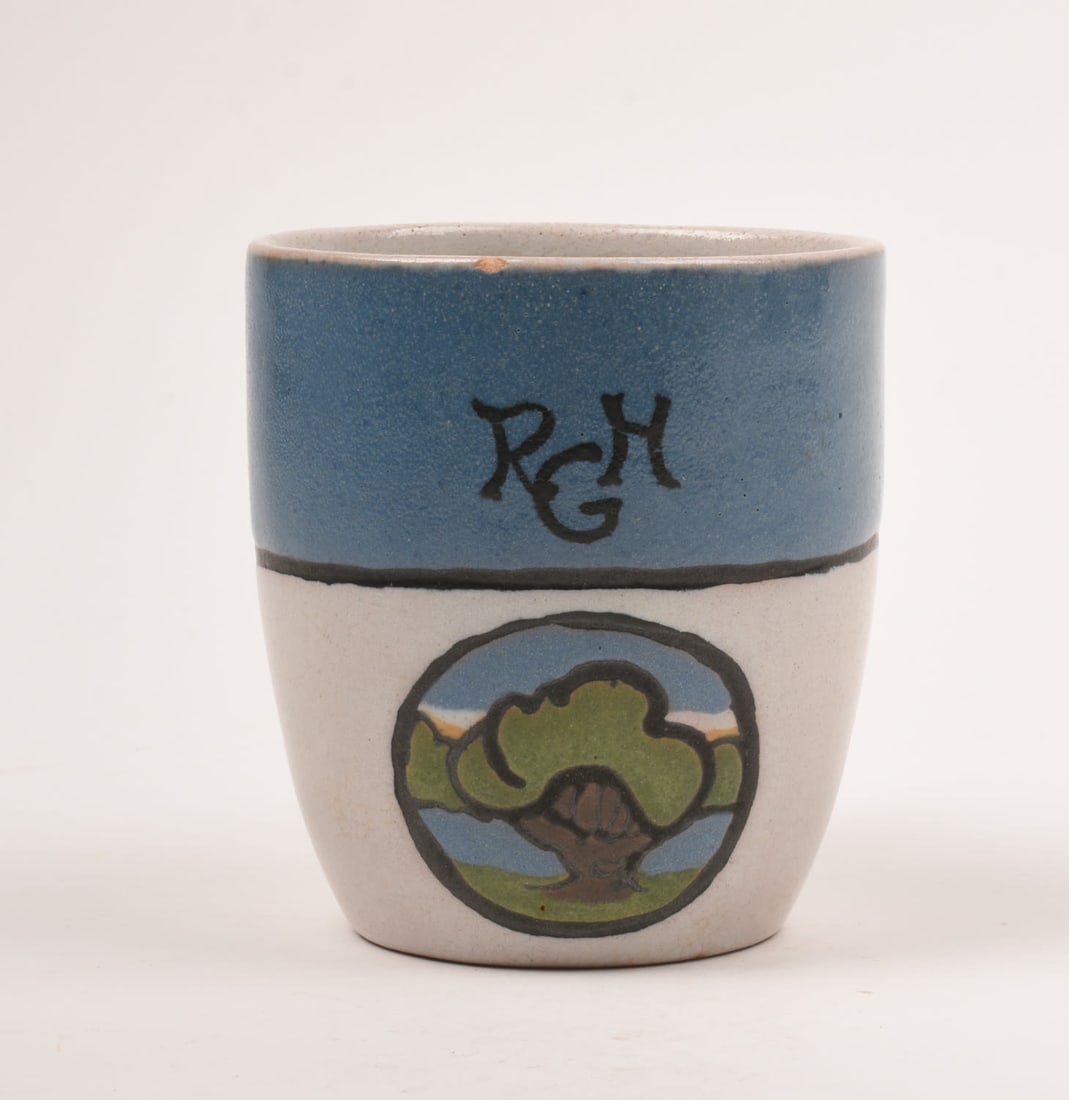 Saturday Evening Girls Mug: with Landscape Medallion. 3 1/2 inches high, 3 1/4 inches wide, 4 1/4 inches deep. S.E.G. / 9-21 / SL artist's cipher.