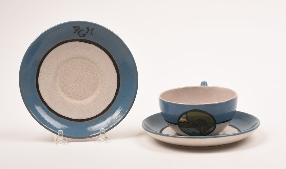 Saturday Evening Girls Cup and Two Saucers: with Landscape Medallion. 1 7/8 inches high, 3 3/4 inches wide, 4 5/8 inches deep. Sara Galner, S.E.G. / 9-21 / artist's cipher.