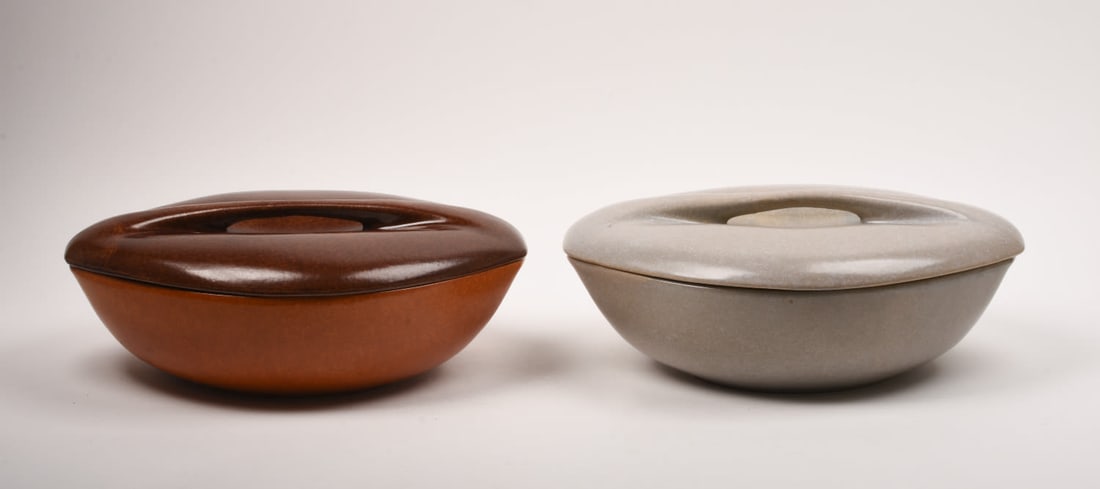 Roseville Raymor Terra Cotta Large Casserole: with an associated brown lid together with a grey example. 5 1/2 inches high, 14 1/4 inches wide, 11 1/2 inches deep, Marked Roseville Raymor USA 185