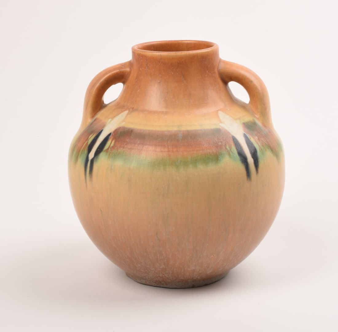 Roseville Pottery Tan Montacello Vase: 7 inches high, 6 5/8 inches diameter, marked 562 in orange