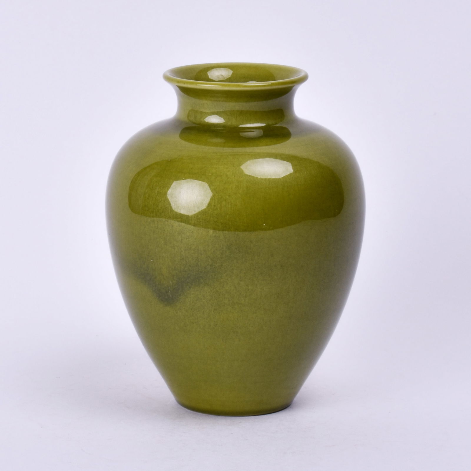 Rookwood Pottery Later Tiger Eye Glaze Vase: covered in a green high glaze. 5 1/2 inches high, 4 3/8 inches diameter, 1938, impressed Rookwood flame mark, XXXVIII/S.
