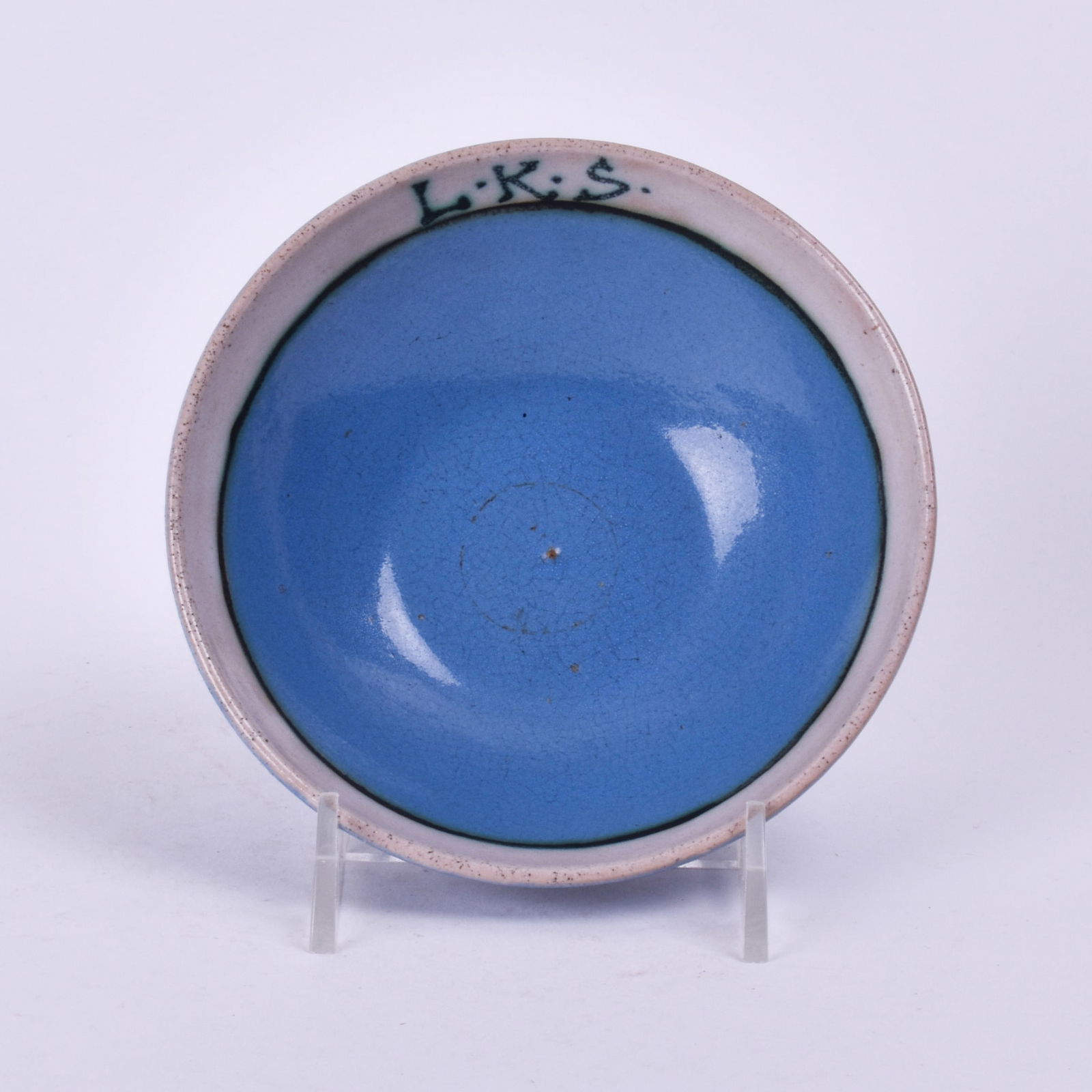 Saturday Evening Girls (Paul Revere Pottery) Bowl: with a blue glaze and white band with initials L.K.S. 1 3/8 inch high, 4 3/4 inches diameter, marked PRP/8-34.