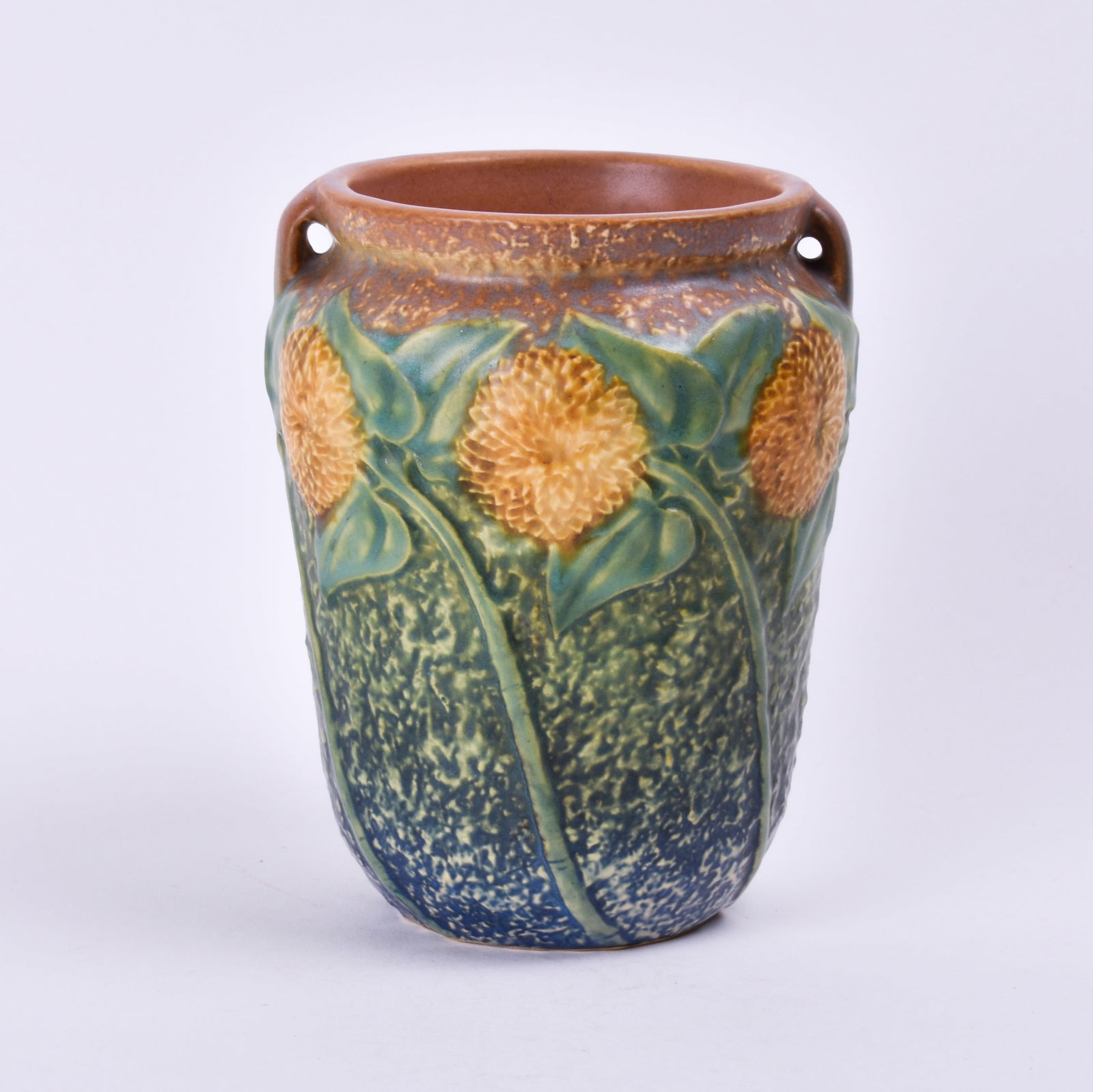 Roseville Pottery Sunflower Vase: 6 1/8 inches high, 4 7/8 inches diameter, unmarked.