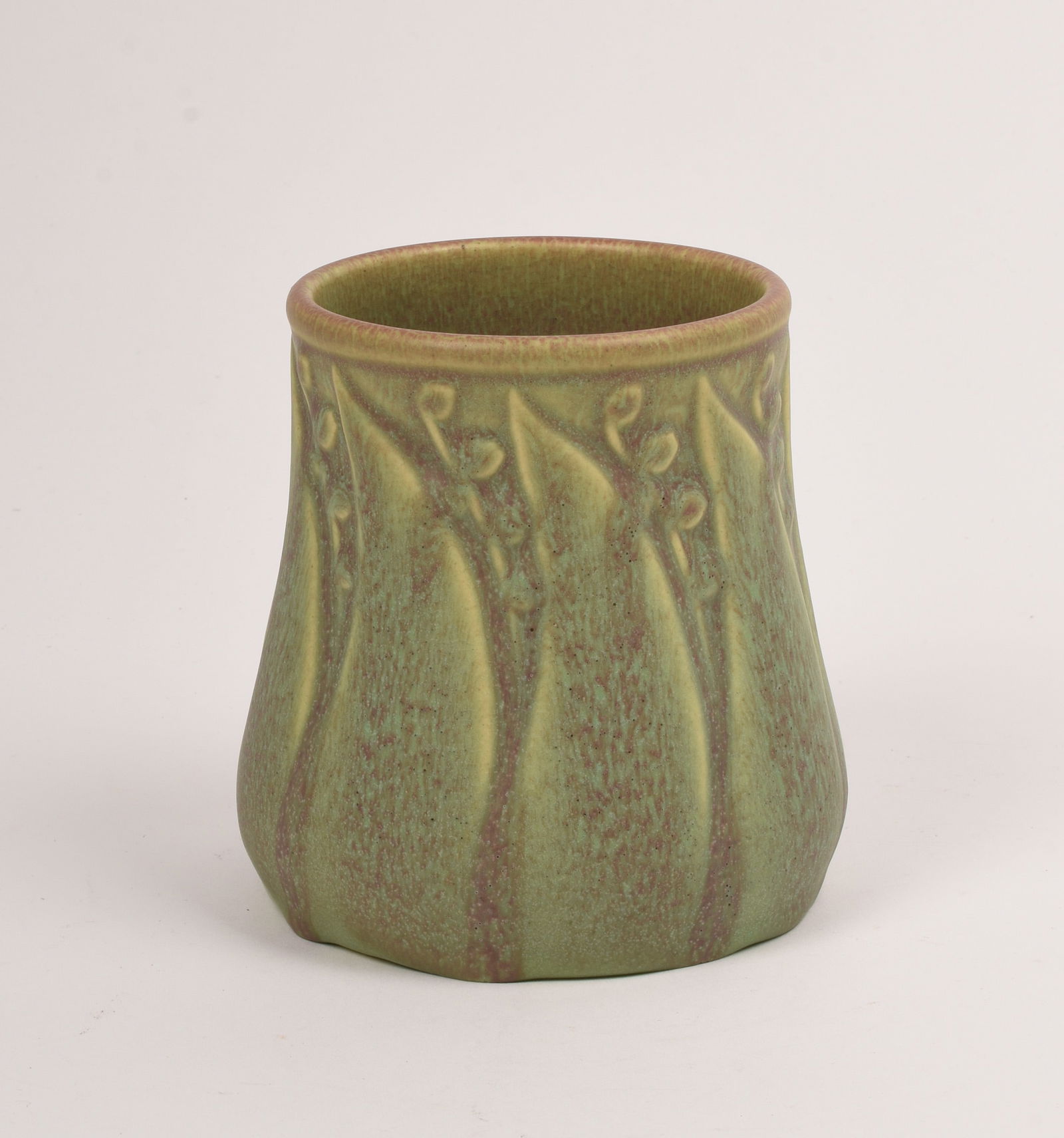 Rookwood Pottery Production Vase: with leaf and buds covered in a speckled matte green and mauve glaze. 1910. 4 3/8 inch high, 4 1/2 inches diameter. Impressed Rookwood Pottery Flame mark, X/1681.