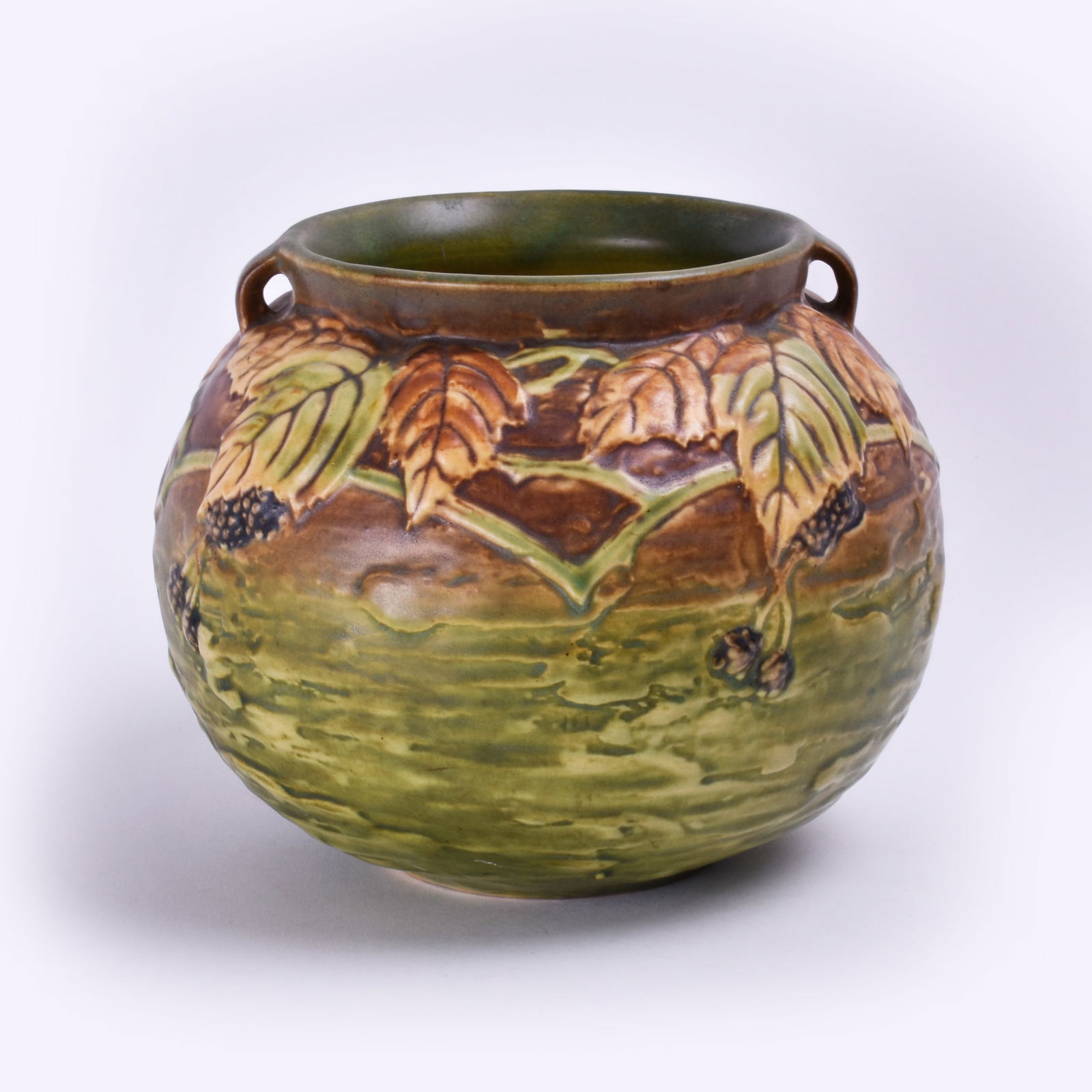 Roseville Pottery Blackberry Vase: 5 7/8 inches high, 7 5/8 inches diameter, black paper label, 574-6.