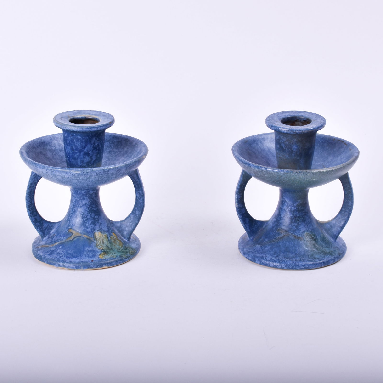 Pair of Roseville Pottery Blue Windsor Candlesticks: 4 inches high, 4 inches diameter, silver paper label.