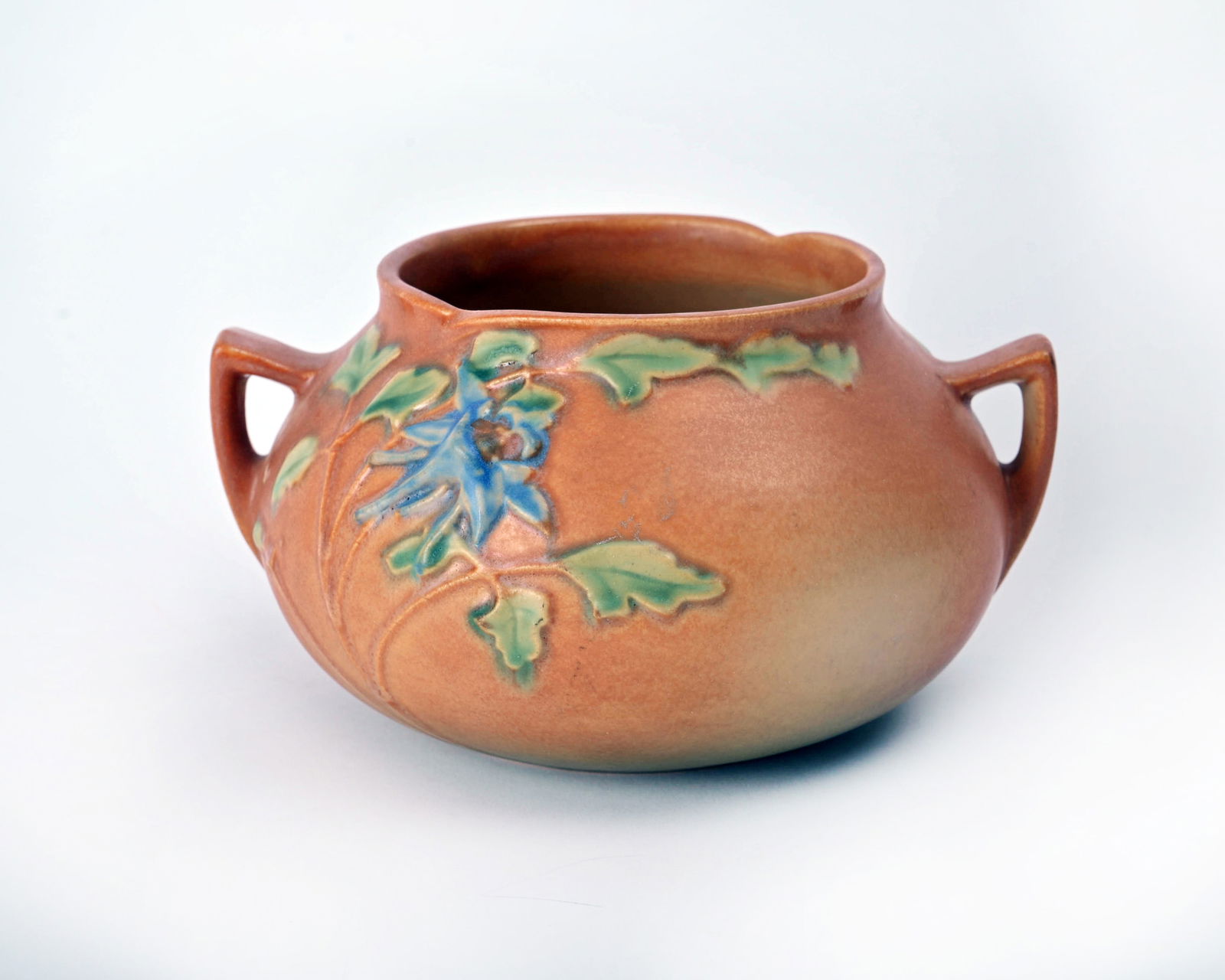 Roseville Pottery Brown Columbine Vase: 4 inches high, 7 1/2 inches wide, 6 3/4 inches deep, marked Roseville USA 399-4.