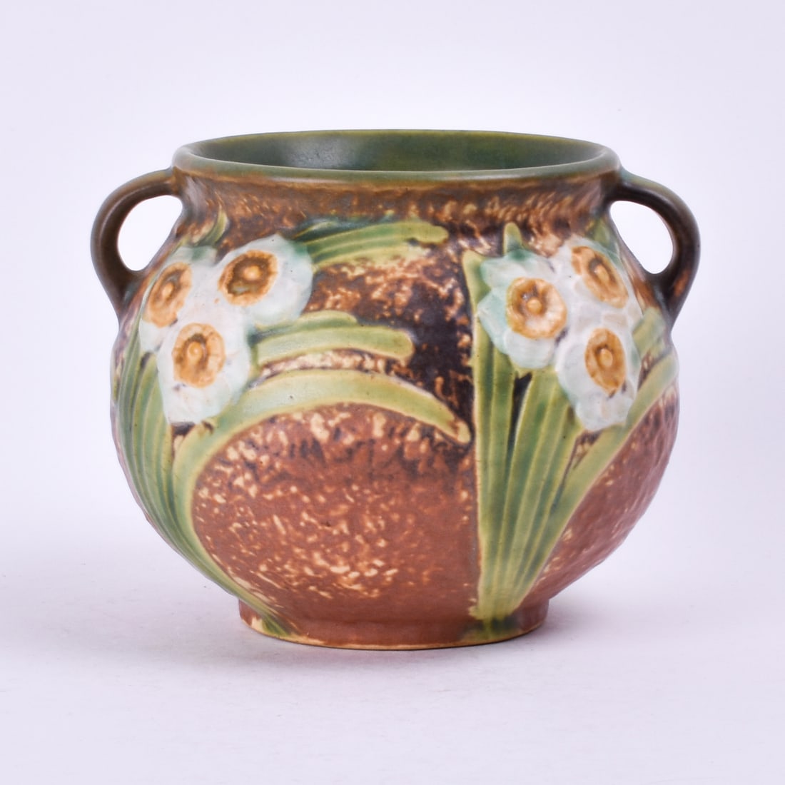 Roseville Pottery Jonquil Jardiniere: 4 inches high, 5 1/4 inches wide, 5 inches deep, unmarked.