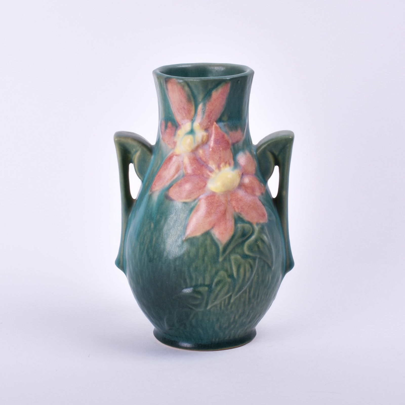 Roseville Pottery Green Clematis Vase: 8 1/4 inches high, 5 1/2 inches wide, 5 1/4 inches deep, marked Roseville U.S.A 103-8.
