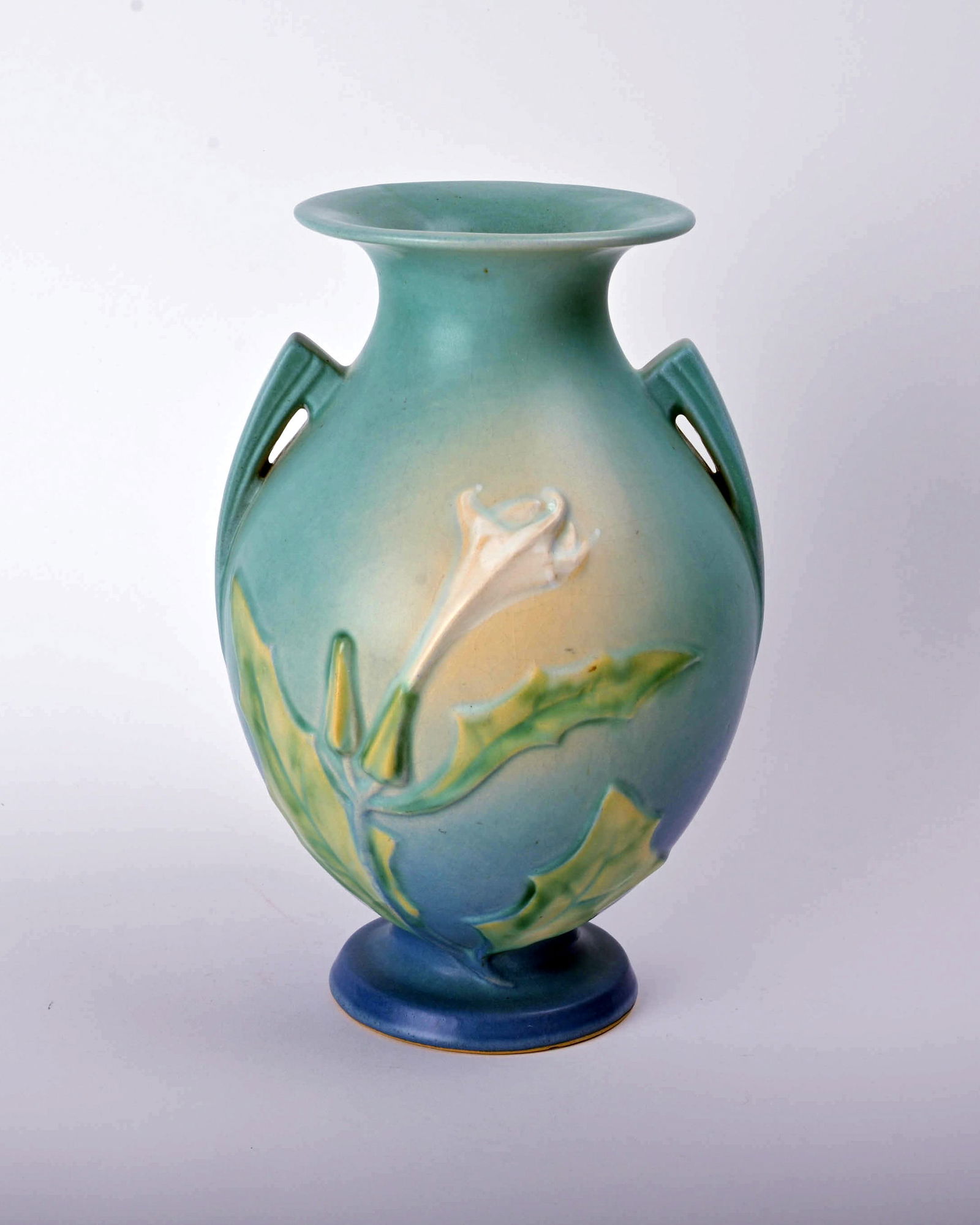 Roseville Pottery Blue Thorn Apple Vase: 10 3/8 inches high, 7 inches wide, 7 1/8 inches deep, marked Roseville 821-10.