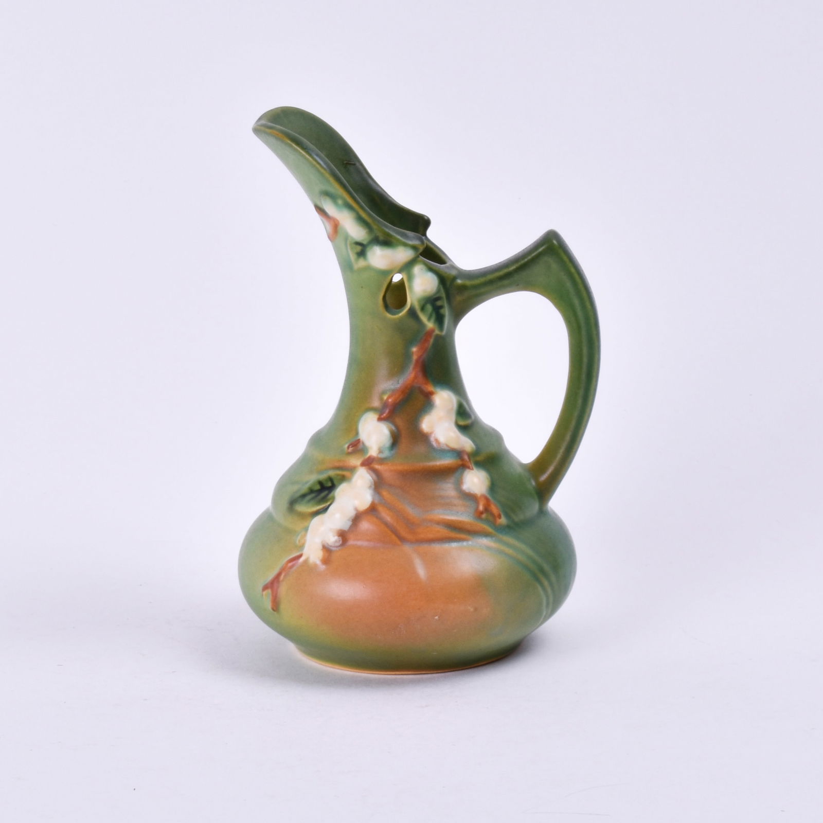 Roseville Pottery Green Snowberry Ewer: 6 3/8 inches high, 4 1/4 inches wide, 4 inches deep, marked Roseville U.S.A ITK-6.