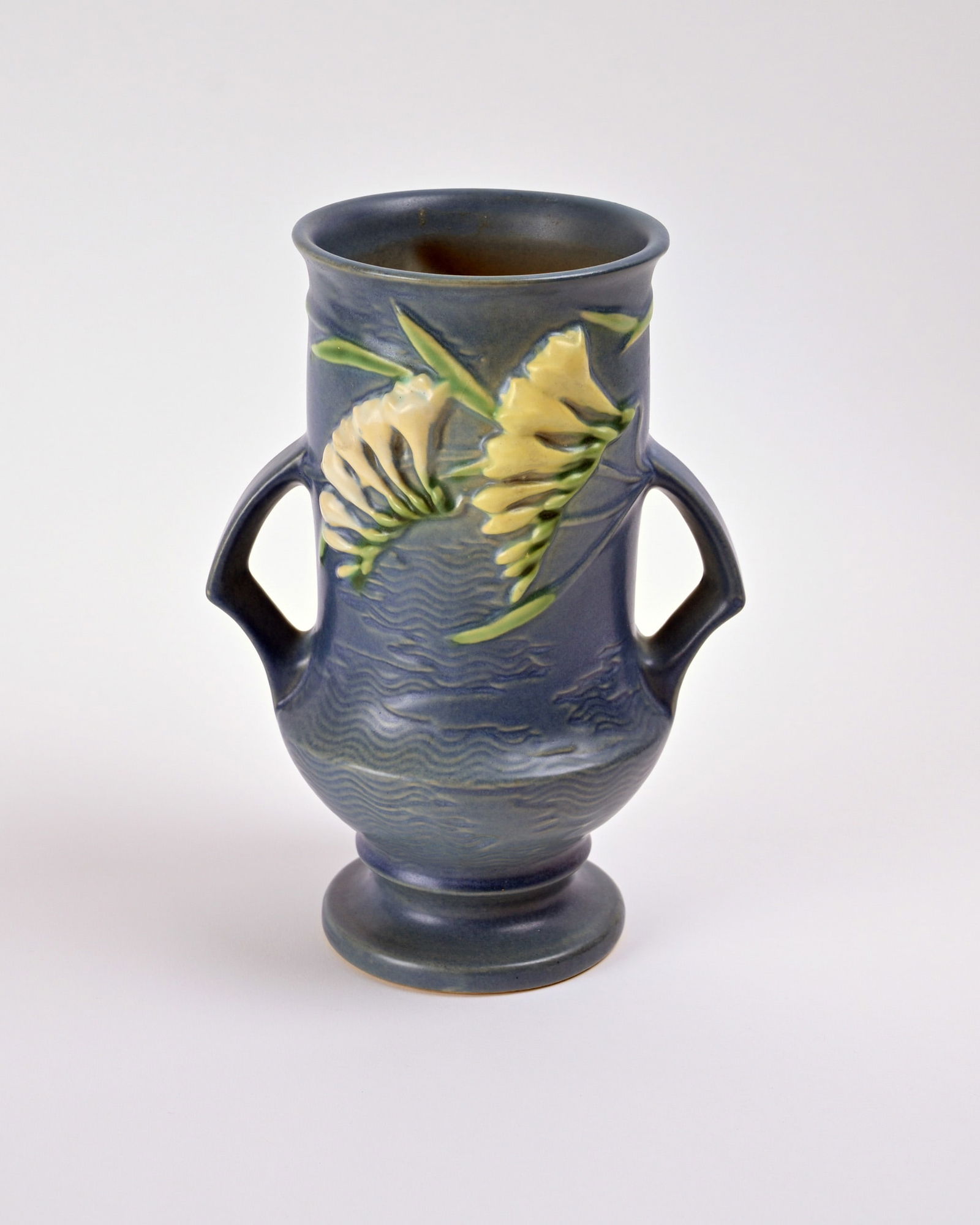 Roseville Pottery Blue Freesia Vase: 9 1/2 inches high, 6 7/8 inches wide, 5 1/8 inches deep, marked Roseville U.S.A 123-9.