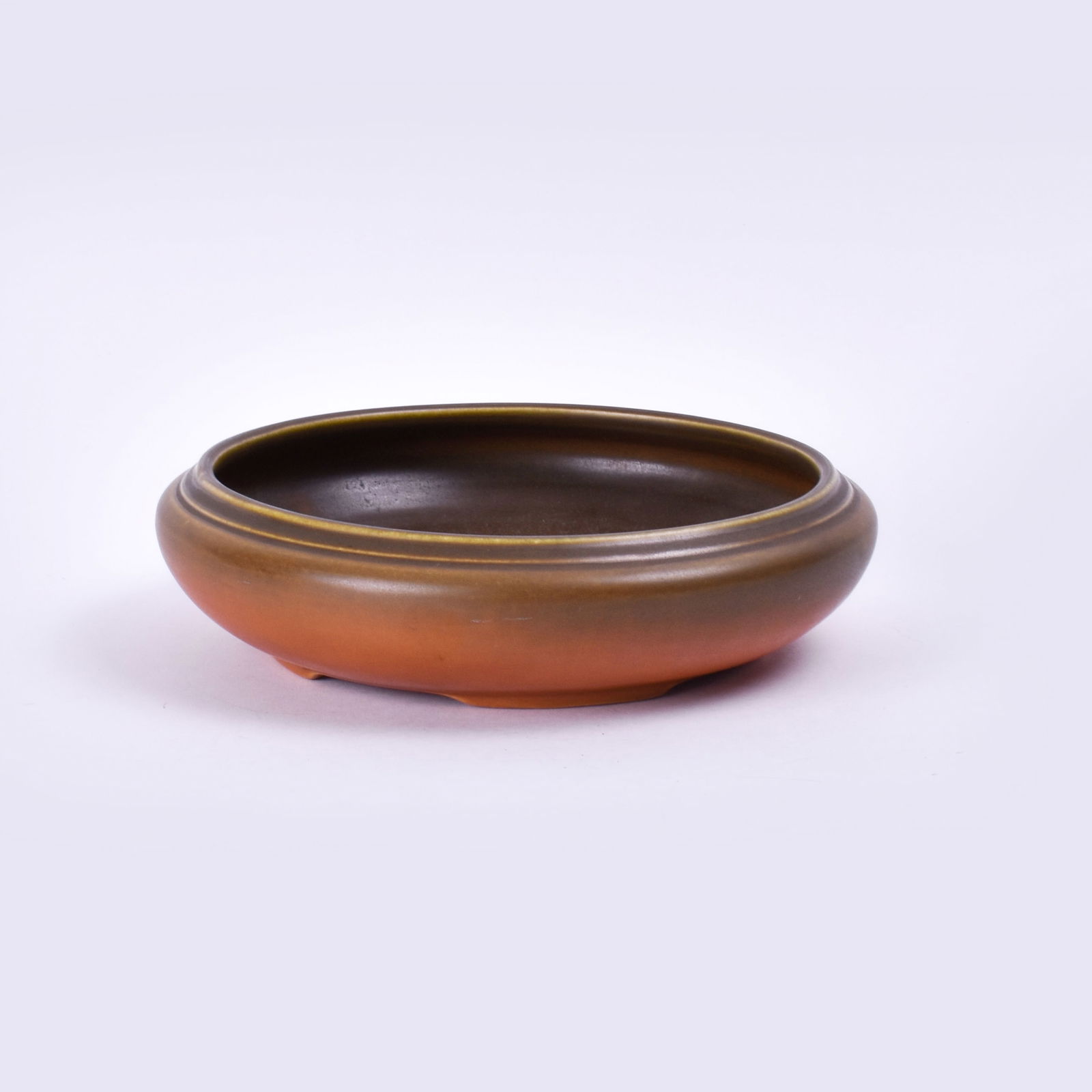 Roseville Pottery Burnt Orange Rosecraft Bowl: 2 1/8 inches high, 8 5/8 inches diameter, marked Rv blue ink stamp.