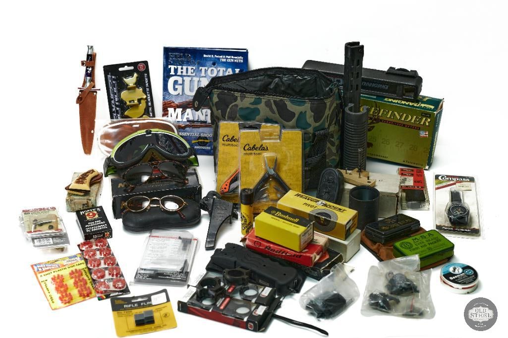 Assorted Lot of Miscellaneous Items: This lot contains a wide array of miscellaneous items such as: Field and Stream The Total Gun Manual book, shotgun chokes, snake bite kite, weatherproof matches, Bushnell Telemeter, Scope rings, recoi