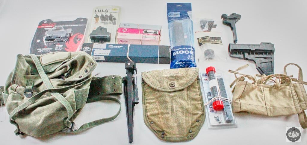 Miscellaneous Firearm Accessories: This is a lot of miscellaneous accessories including: -KCI Glock 9mm Magazine -Lula AR magazine loader - FN P90/PS90 magazine -Ruger BX-Trigger for 10/22 -Burris scope base/rings -6 Chamber speed