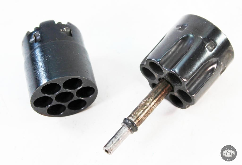 Revolver Cylinders - Black Powder 44 Cal - Cartridge chamber 41 Cal: 2 revolver cylinders. One is a blackpowder, 44 caliber cylinder with the naval scene rollmark. The other is an unmarked cylinder that appears to fit 41 Rem Mag cartridges. 