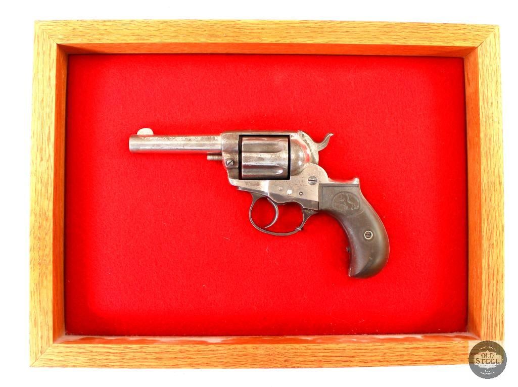 Colt M1877 'Lightning' Display Revolver - 38 Long Colt - Antique: Here we have a Colt M1877 'Lightning' revolver chambered in .38 Long Colt. The revolver is mounted to a frame and currently is non functional, need of repairs. The back grip panel that is not exposed 