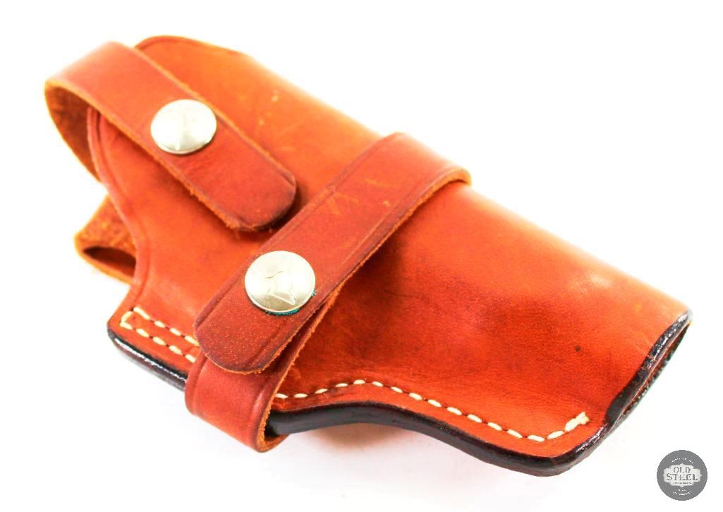 Longhorn 10-73 Brown Leather Holster: Open end Longhorn Model 10-73 brown leather holster. Maybe for a revolver or judging from the forming of the leather perhaps even a 1911. THIS I