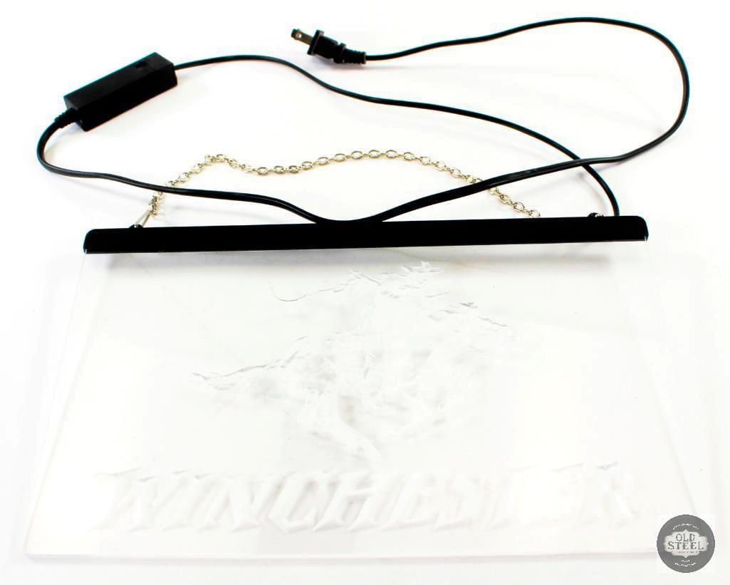 Winchester Light Up Sign: For this lot we have a light sign with the Winchester logo that measures 12x7.5 inches. The switch does not appear to be in working order and currently does not illuminate. 