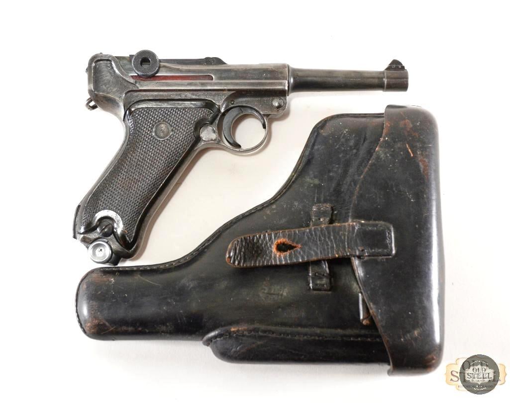 Vopo Mauser Luger P.08 and Holster - 9mm Luger East German Police: This lot contains a Vopo Mauser WWI Luger P.08 and its matching black leather holster. This pistol has many matching serial numbers and even its matching serialized magazine, the toggle is marked S/42