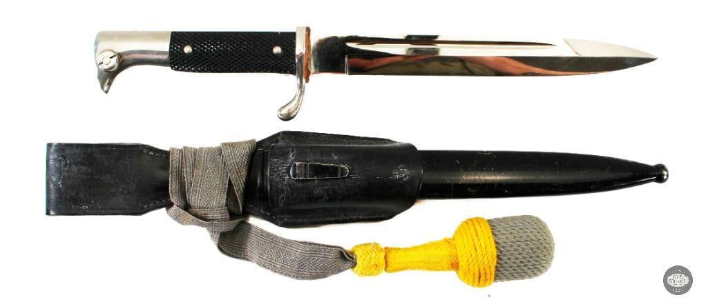 K98 Dress Bayonet with NCO Troddel: This is a dress bayonet for the K98 rifle, complete with its sheath and acorn troddel. The coloring of the troddel denotes that this was intended to be carried by an NCO of the German Heer. The fittin