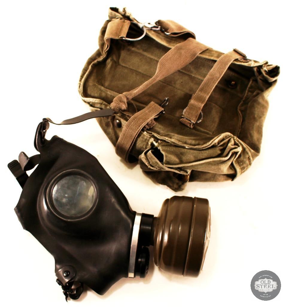 Drager Simplex Gas Mask and Canvas Carrying Bag: Following the design of early German M38 gas masks, this mask is a more modern version designed by Dr...ger featuring a rubberized design and a more modern filter. Also included is its green canv