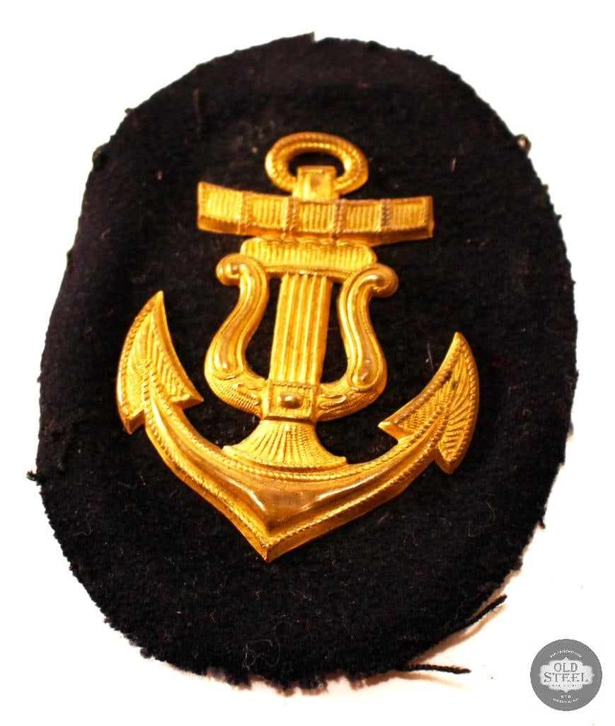 Kriegsmarine Naval Musician NCO Career Badge with Metal Backer: Here we have a metal backed Kriegsmarine career badge for a naval musician NCO. THIS ITEM IS AS PICTURED WITH NO FURTHER ATTACHMENTS. ALL SA
