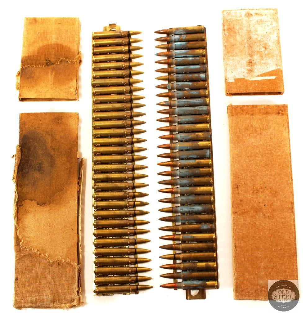 7.7 Japanese Type 92 Machine Gun - 60rds: Two racks of 7.7mm Japanese ammunition in the box for the Type 92 machine gun. One rack shows oxidation on the cases and a mixed set of ammunition, red, black and sp bullets. 