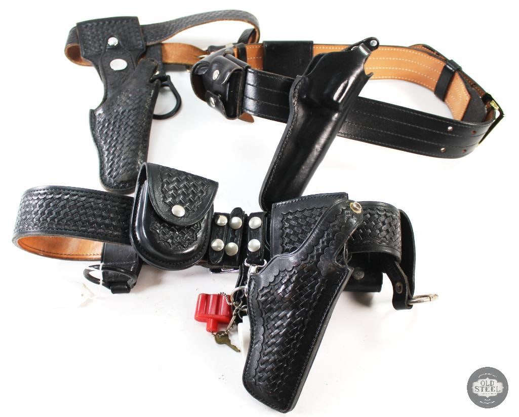 Lot of 2 Police Gun Belts with Holsters and Pouches: Two leather Police gun belts with holsters and pouches. THIS ITEM IS AS PICTURED WITH NO FURTHER ATTACHMENTS. ALL SALES ARE FINAL. PLEASE REFER