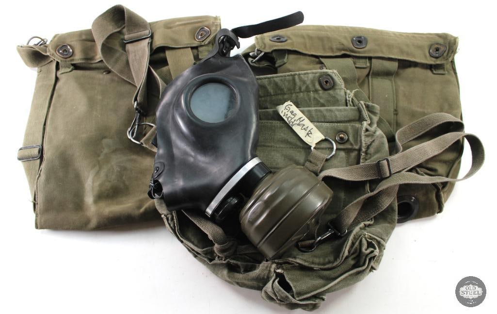Gas Mask and Gas Mask Carrying Pouches: Two M25A1 US Gas mask carrying pouches and one German gas mask c.1968 with Zivilschutzfilter filter THIS ITEM IS AS PICTURED WITH NO FURTHER ATTACHMEN