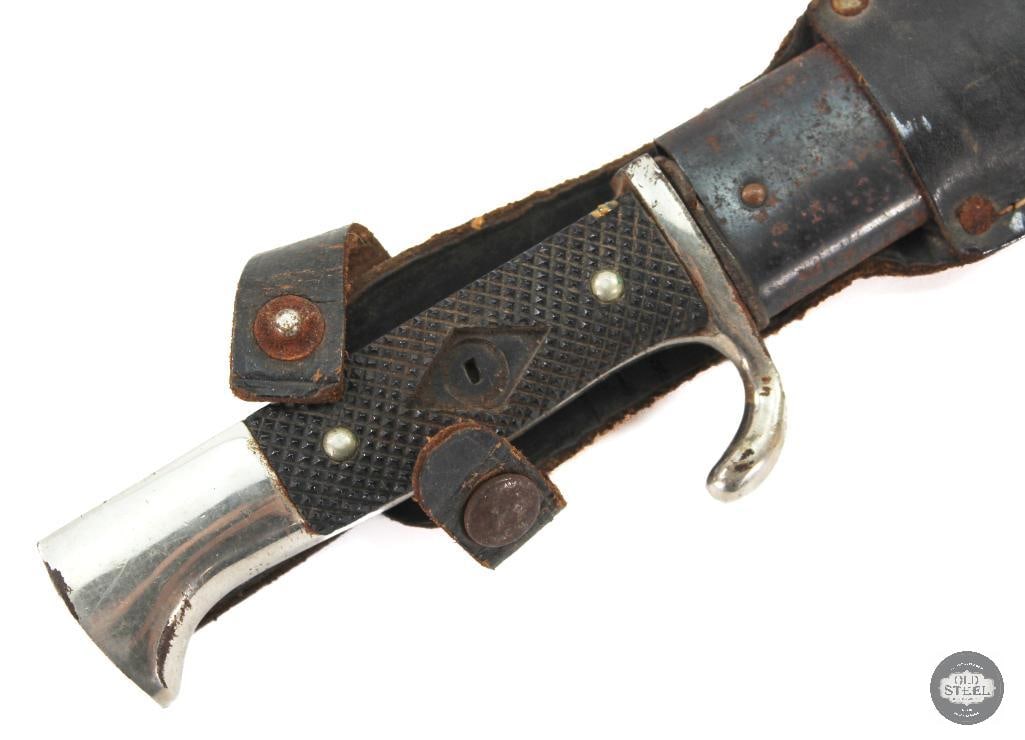 Hitler Youth Knife and Scabbard WWII German - Missing Inlay: Take a peek at this Hitler Youth knife! The scabbard is protected by a 2ndary leather sheath. The grip is missing its inlaid medallion. The blade sports patina expectedly and has Blut und Ehre! etched