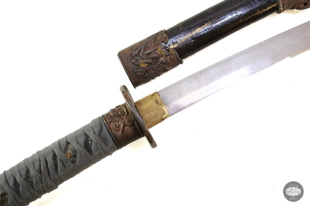 Katana Sword and Scabbard: A katana sword with scabbard. The grip is missing a dowel and would benefit from rewrap. This is not authentic. THIS ITEM IS AS PICTURED WITH NO
