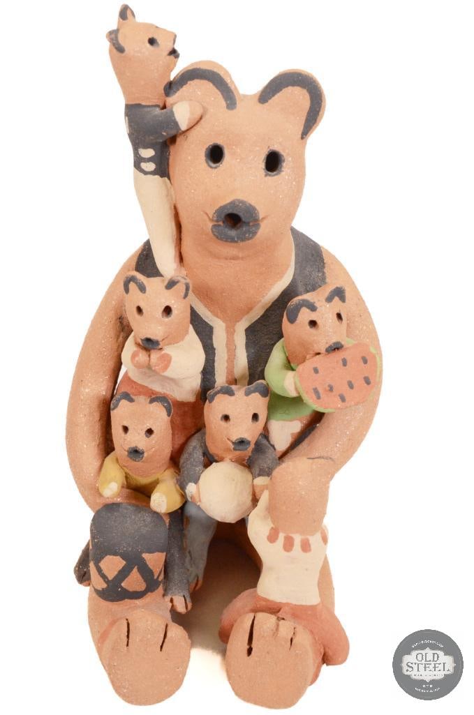 Authentic Indian Bear Storyteller Figurine - Juanita Signed: The figurine is a bear storyteller, a variation of the traditional human storyteller figures from the Pueblos of New Mexico. While the original storyteller figures, created by Helen Cordero of Cochiti
