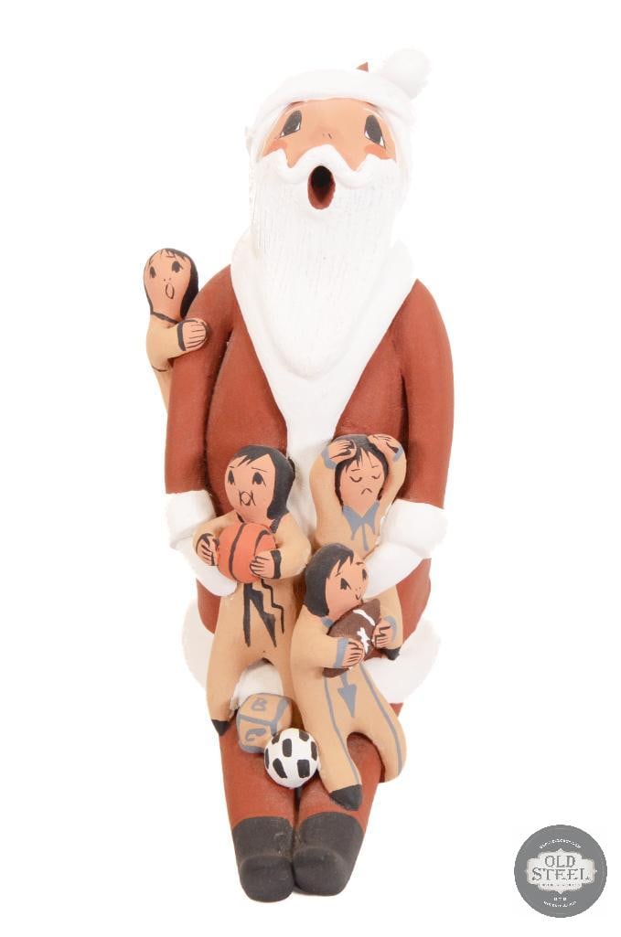 Authentic Jemez Santa Storyteller - D. Lucero Signed: The figure is a Santa storyteller, a variation of the traditional Native American storyteller figures. This style combines the cultural significance of Pueblo storyteller pottery with the holiday