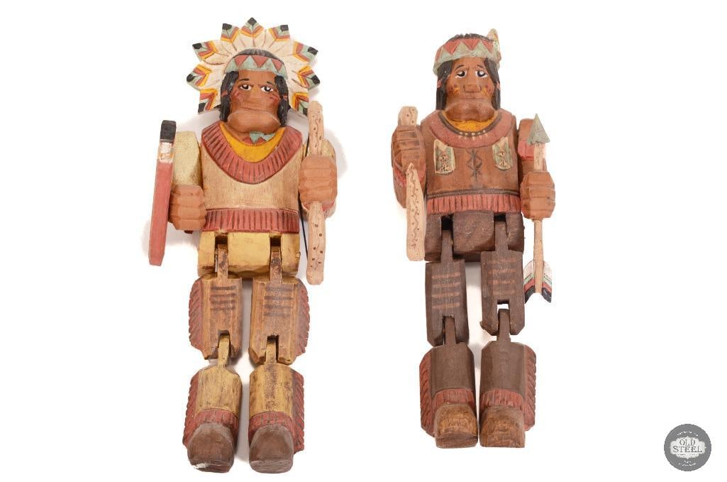 Pair of Wooden Native American Action Figure Toys: This lot has 2 action figures with articulation legs. All made of wood. Unlikely Native American make and simply inspired. Partial stickers on back show Made in China. These figures are about 9 inches