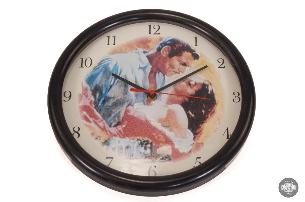Gone With the Wind Wall Clock - 1989: Simple wall clock with Rhett and Scarlett adorning the face. THIS ITEM IS AS PICTURED WITH NO FURTHER ATTACHMENTS. ALL SALES ARE FINAL. PLEASE R