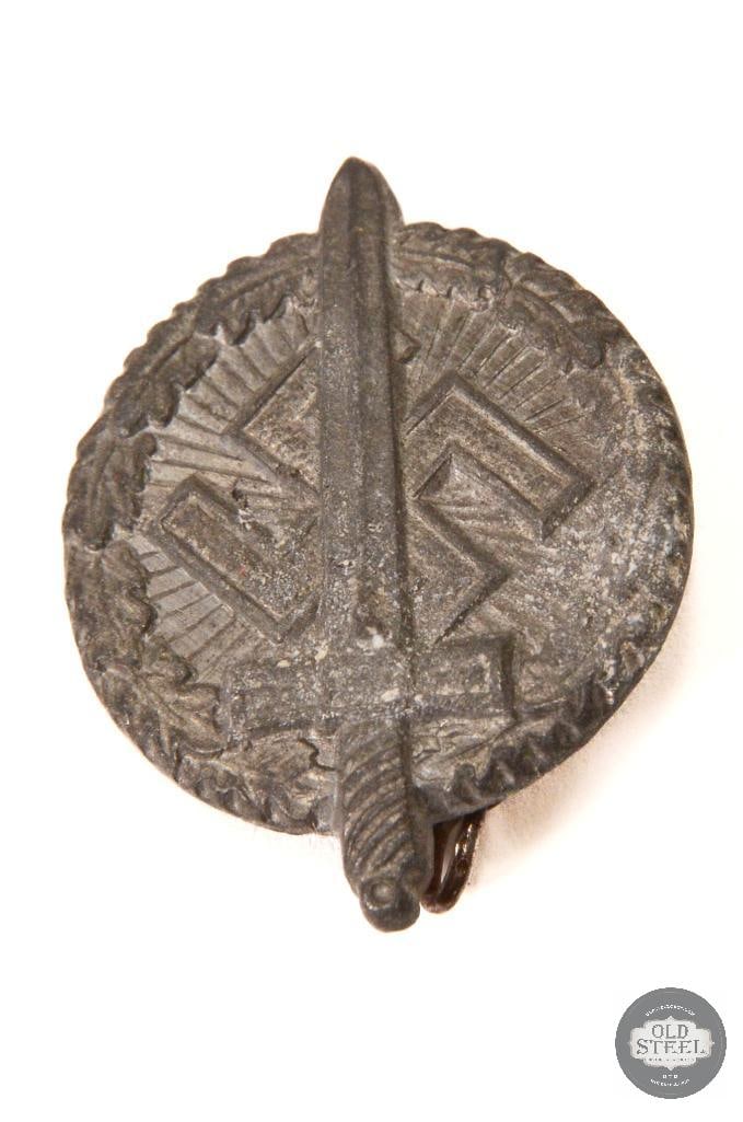 NSKOV Donation Sword Swastika Tinnie - WWII German: NSKOV Donation Sword Swastika Tinnie - WWII German THIS ITEM IS AS PICTURED WITH NO FURTHER ATTACHMENTS. ALL SALES ARE FINAL. PLEASE REFER TO THE AUCT
