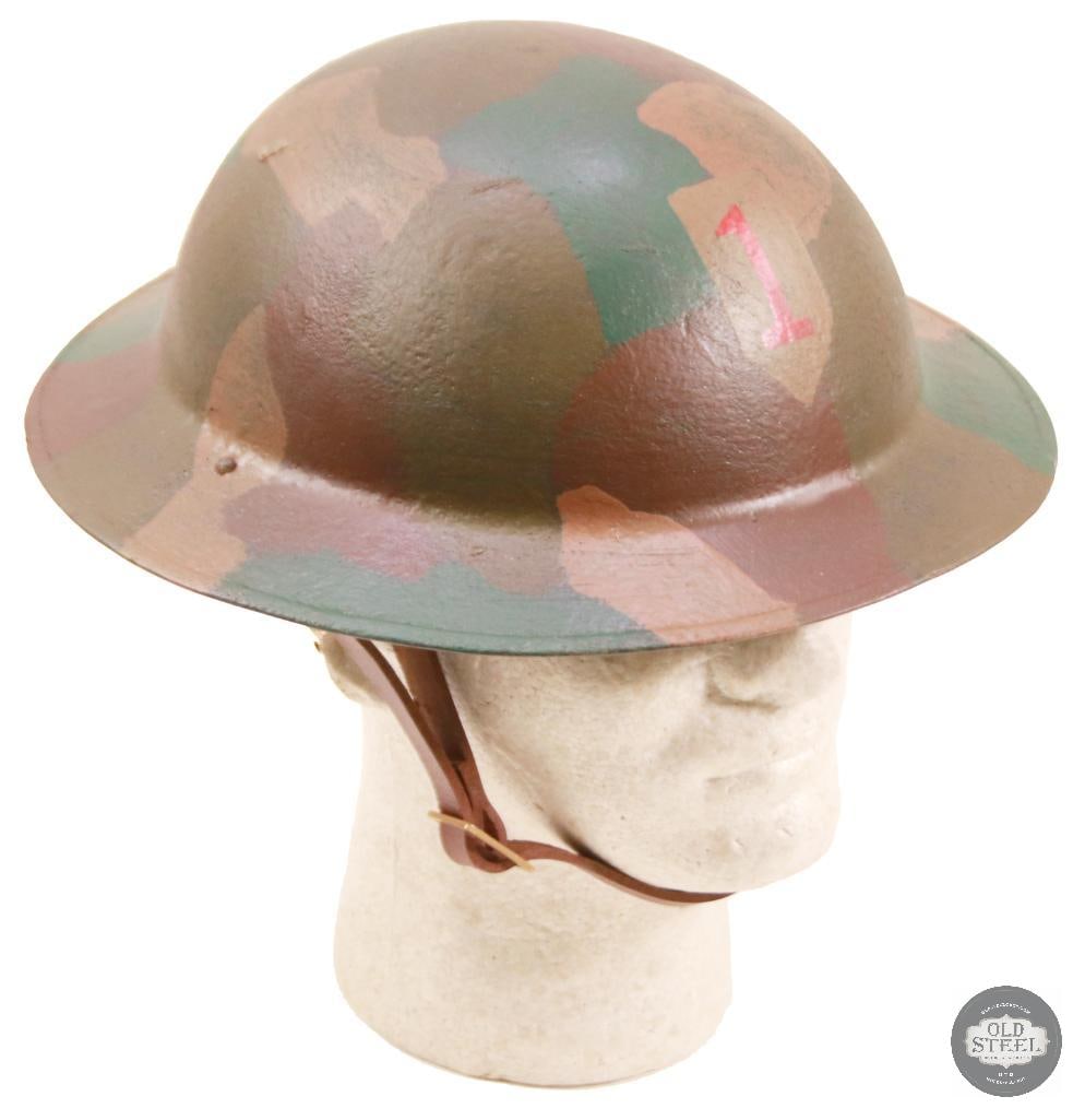 M1917 US WWI Doughboy Helmet with Camouflage Pattern Paint: Original American steel helmet shell, professionally refurbished with new liner, paint, and applied camouflage finish with unit insignia. Refurbishment presents a WWII-era field appearance while retai