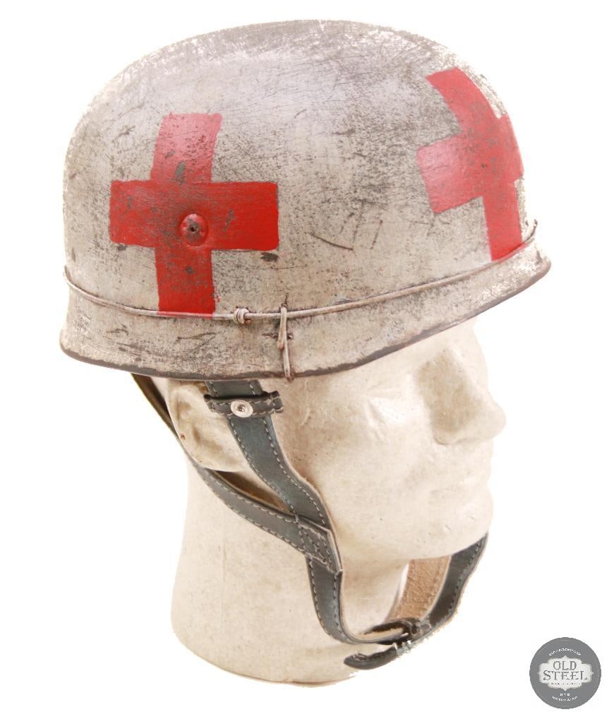 M38 Fallschirmjager German WWII Paratrooper Helmet With Wire and Medic Camo Paint: Original German M38 paratrooper steel helmet shell, professionally refurbished with new liner, paint, and applied wire with medic-style camouflage finish. Refurbishment presents a WWII-era airborne