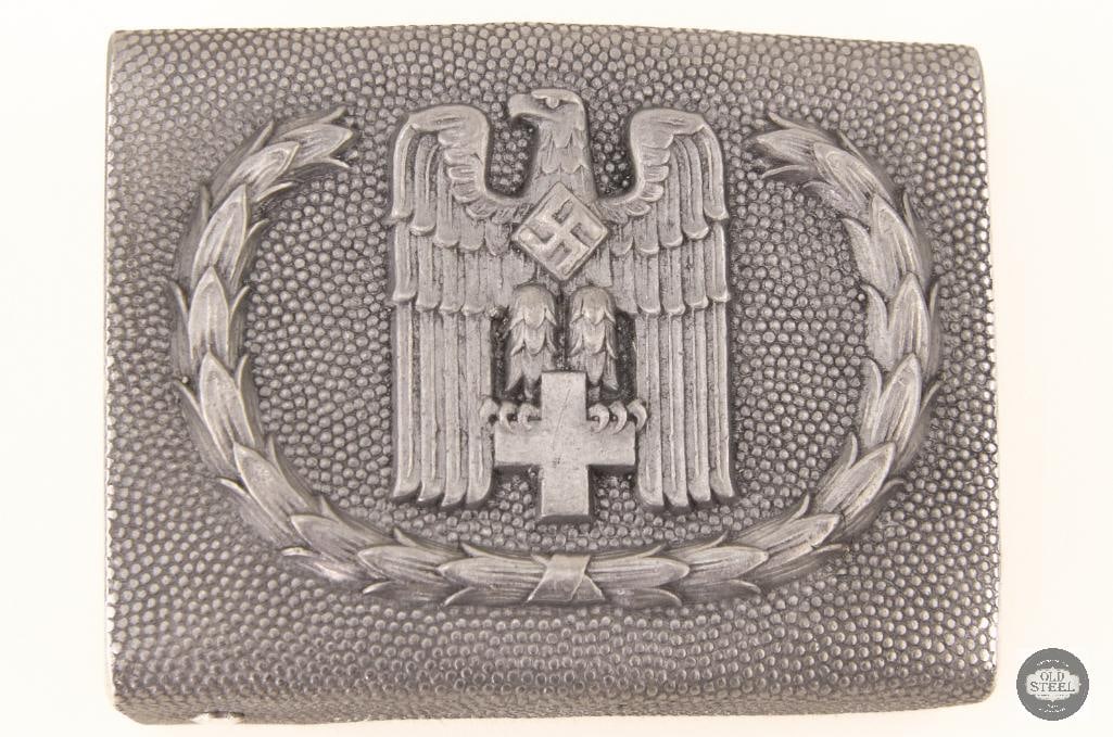 (DRK) Enlisted/NCO's Belt Buckle: WWII German Red Cross (DRK) Enlisted/NCO's Belt Buckle, pressed aluminum GES.GESCH1 marked . THIS ITEM IS AS PICTURED WITH NO FURTHER ATTACHMENTS. ALL SALES ARE FINAL. PLEASE REFER TO THE