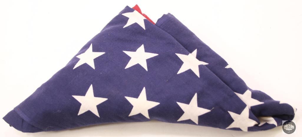 Vintage Folded American Flag: Vintage folded American flag, preserving traditional red, white, and blue fabric. Suitable for display, ceremonial use, or historical collection. THIS