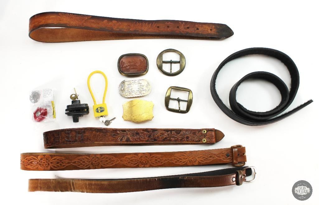 Various Belts, Belt Straps, Buckles and Gun Locks: 3 of the belts don't have the buckles attached. 1 is a Safariland Large with pile underside. The other two are embellished with leather embossing and carvings. There are two belts complete. There are