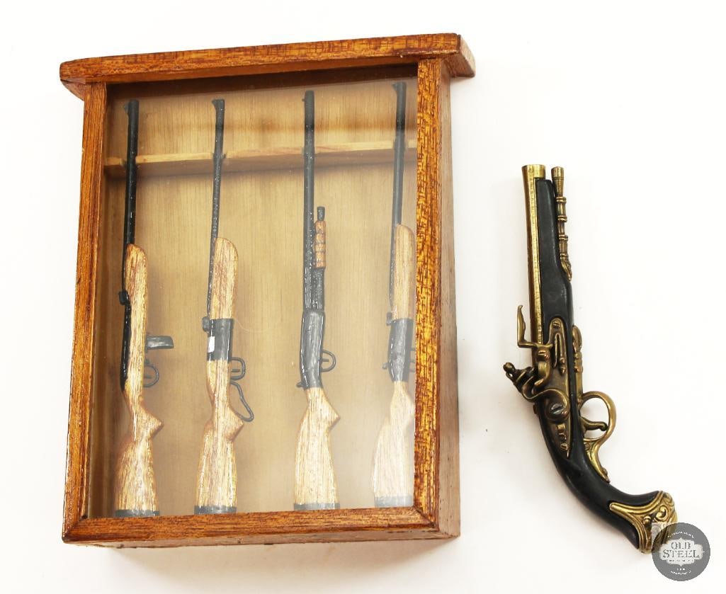 London George Washington Replica Miniature Flintlock Pistol and Wooden Long Gun Display Case Model: London George Washington Replica Miniature Flintlock Pistol and Wooden Long Gun Display Case Model. Case stands about 8 inches tall. THIS ITEM IS AS PICTURED WITH NO FURTHER ATTACHMENTS.