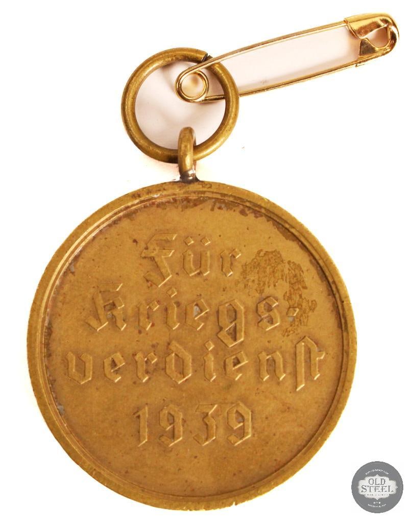 German Third Reich War Merit Medal - Kriegsverdienstmedaille 1939 - WWII: German Third Reich War Merit Medal - Kriegsverdienstmedaille 1939 - WWII THIS ITEM IS AS PICTURED WITH NO FURTHER ATTACHMENTS. ALL SALES ARE FINAL. PLEASE REFER TO THE AUCTION DESCRIPTION, LOT