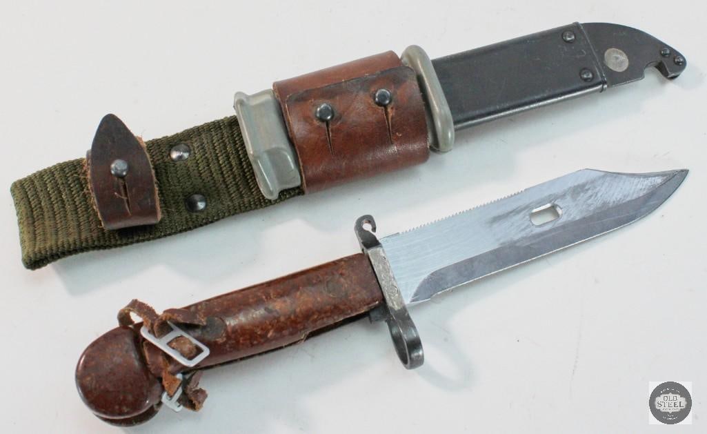 AKM Type I Bayonet with Scabbard and Frog: AKM Type I Bayonet with Scabbard and Frog THIS ITEM IS AS PICTURED WITH NO FURTHER ATTACHMENTS. ALL SALES ARE FINAL. PLEASE REFER TO THE AUCTION DESCRIPTION, LOT #1 DESCRIPTION AND TERMS