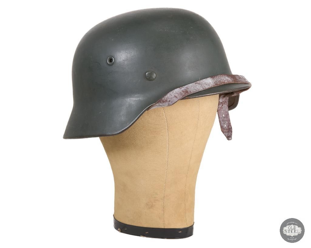 Original M40 German WWII Helmet: Original M40 German WWII helmet with ET66 and 503 marked on the inside of the shell. THIS ITEM IS AS PICTURED WITH NO FURTHER ATTACHMENTS. ALL SALES ARE FINAL. PLEASE REFER TO THE AUCTION