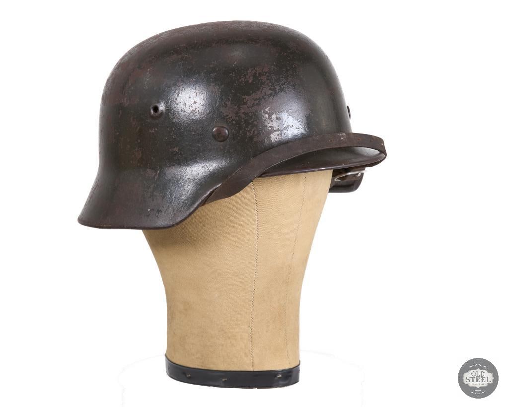 WWII German M40 Heer Helmet: WWII German M40 Heer Helmet. 252 marked on inside at the rear and SF64 on the side. The leather of the liner and chinstrap are in good condition with some flexibility. The rivets holding the headband 